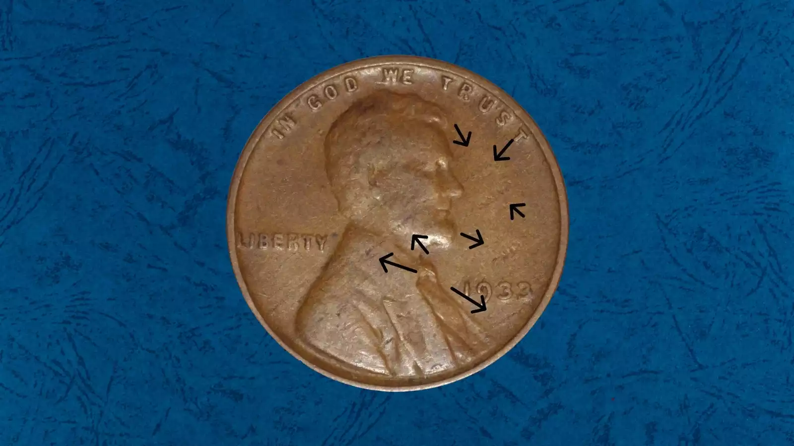 1933 Lincoln Wheat Penny lamination error showing peeling copper surface layer separating from planchet with visible flaking